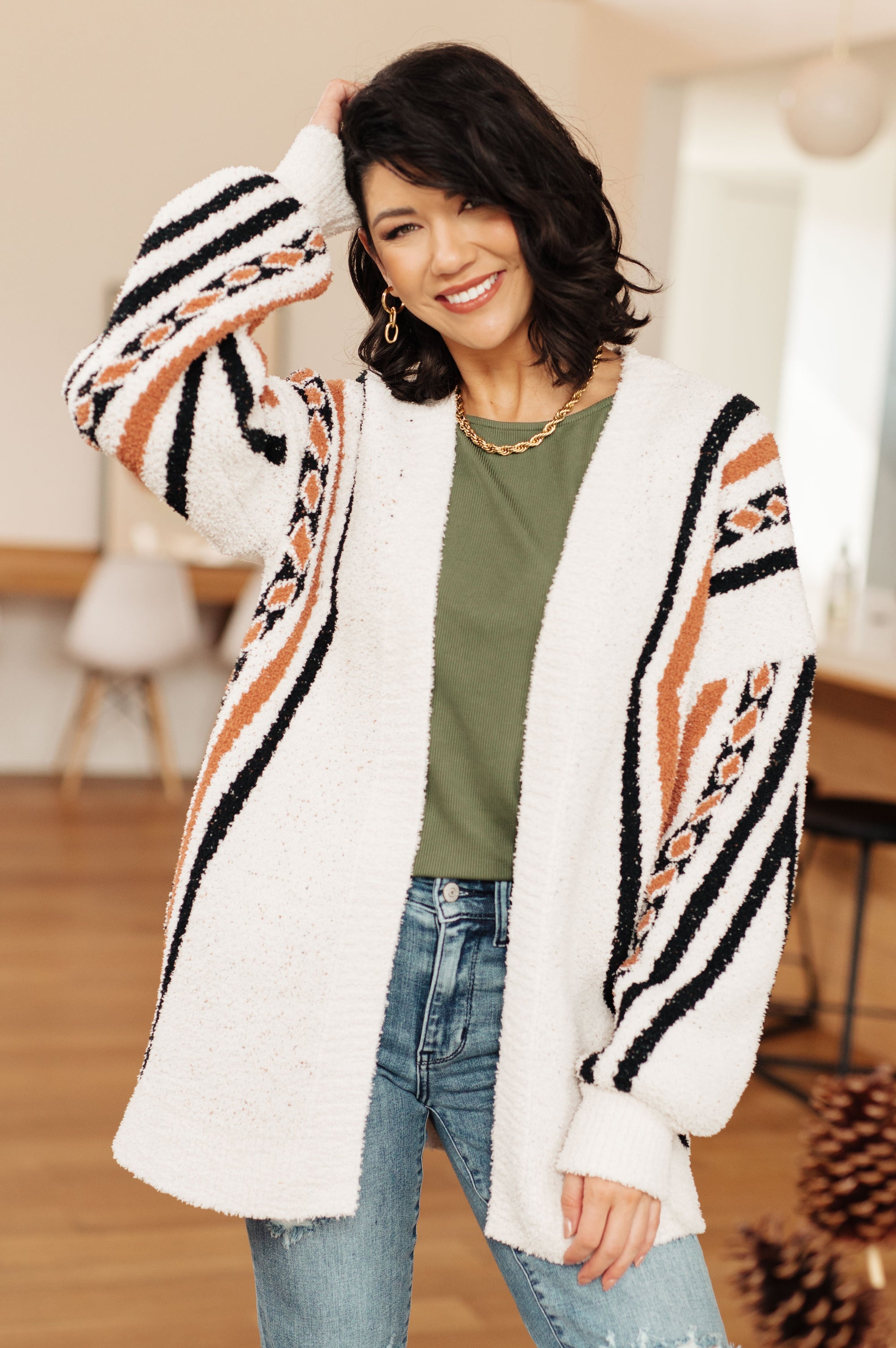 https://shopbellajade.com/cdn/shop/products/HoldingOnAztecPrintCardigan7_2000x.jpg?v=1703176083